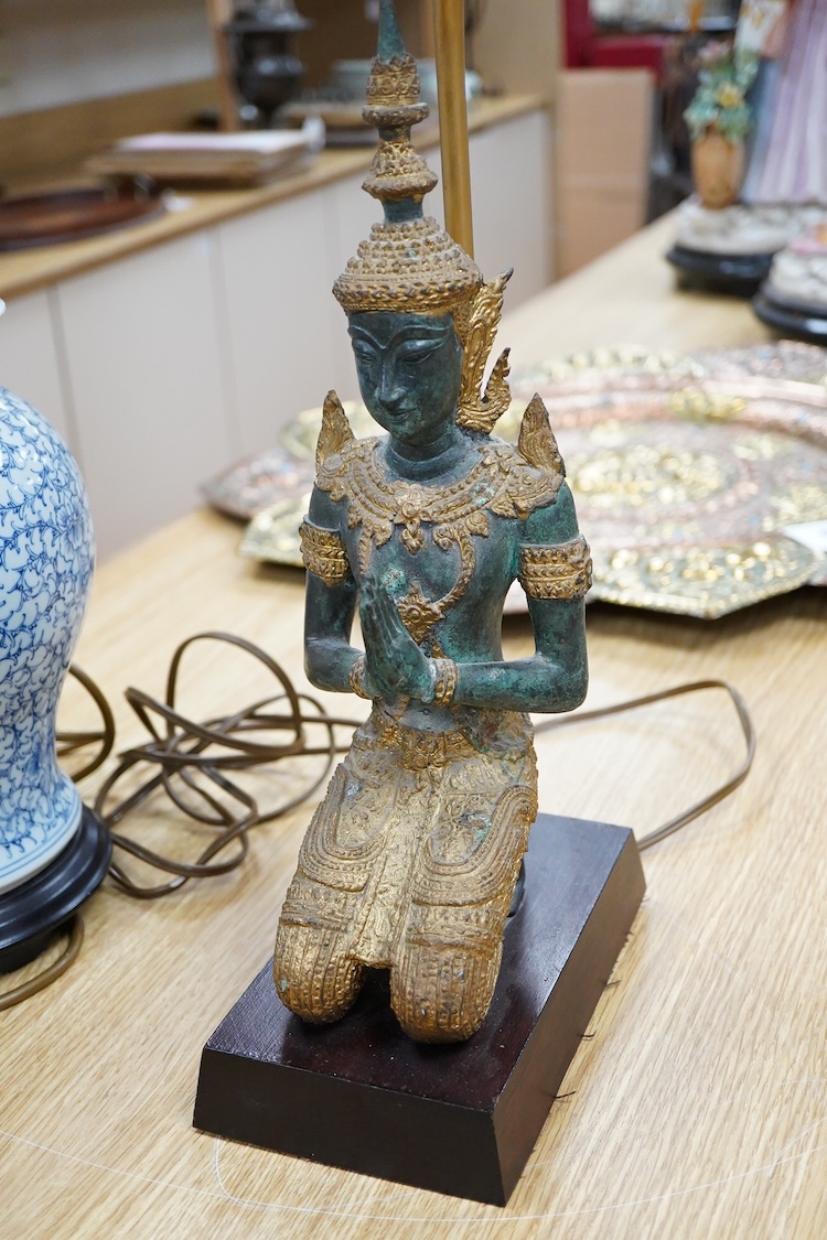 A Chinese blue and white ‘shuangxi’ vase and cover, mounted as a lamp, together with a lamp mounted with a bronze Thai figure, largest 50cm high including light fitting